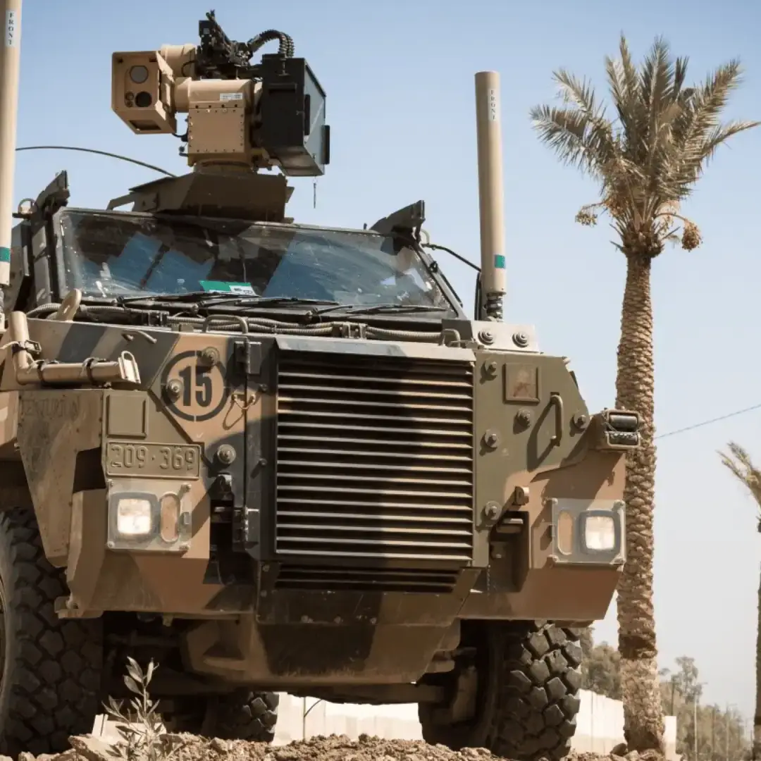 Bushmaster Military Vehicle parked in a beach area