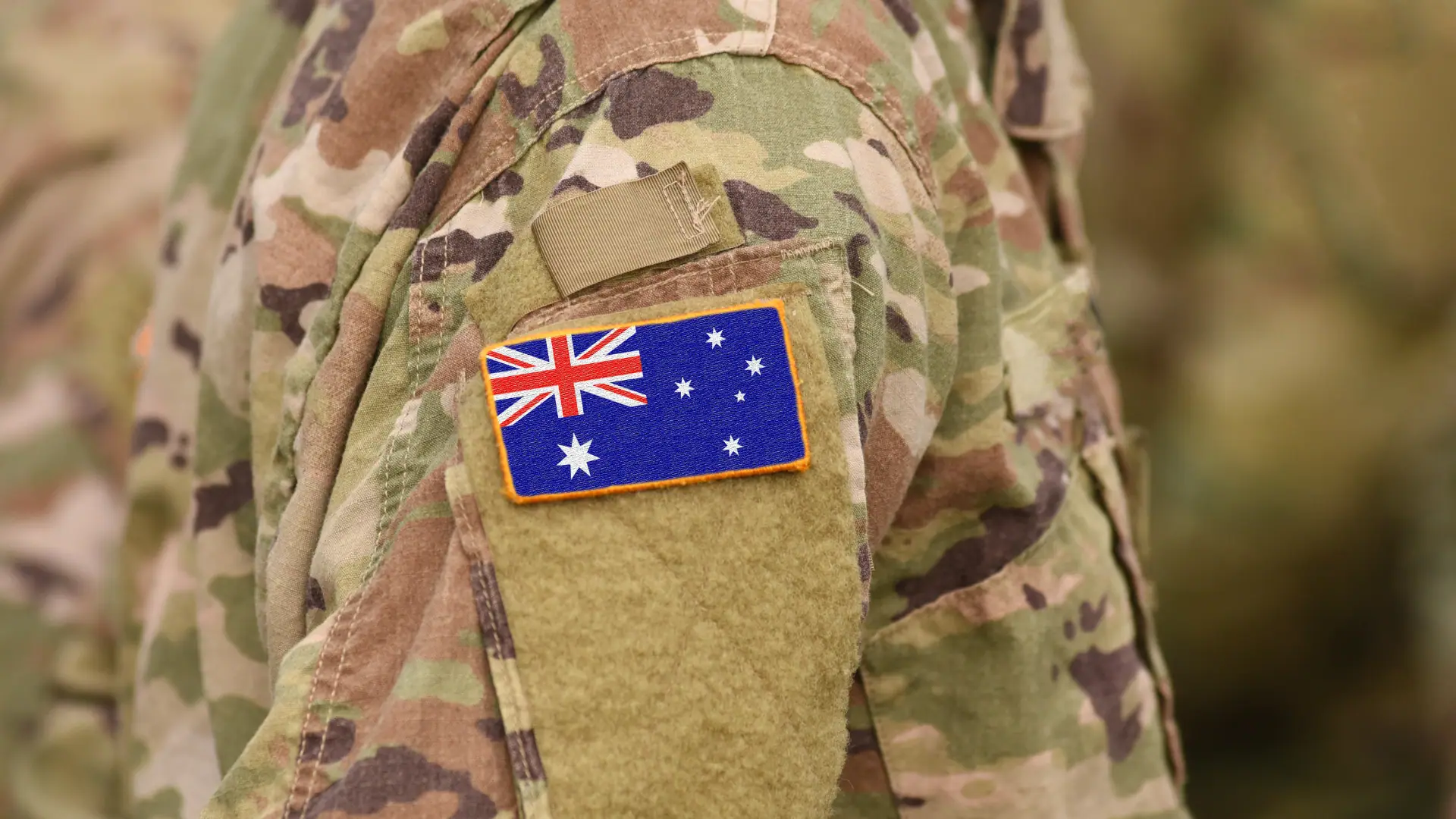 Australian Defence solider with Australian flag.