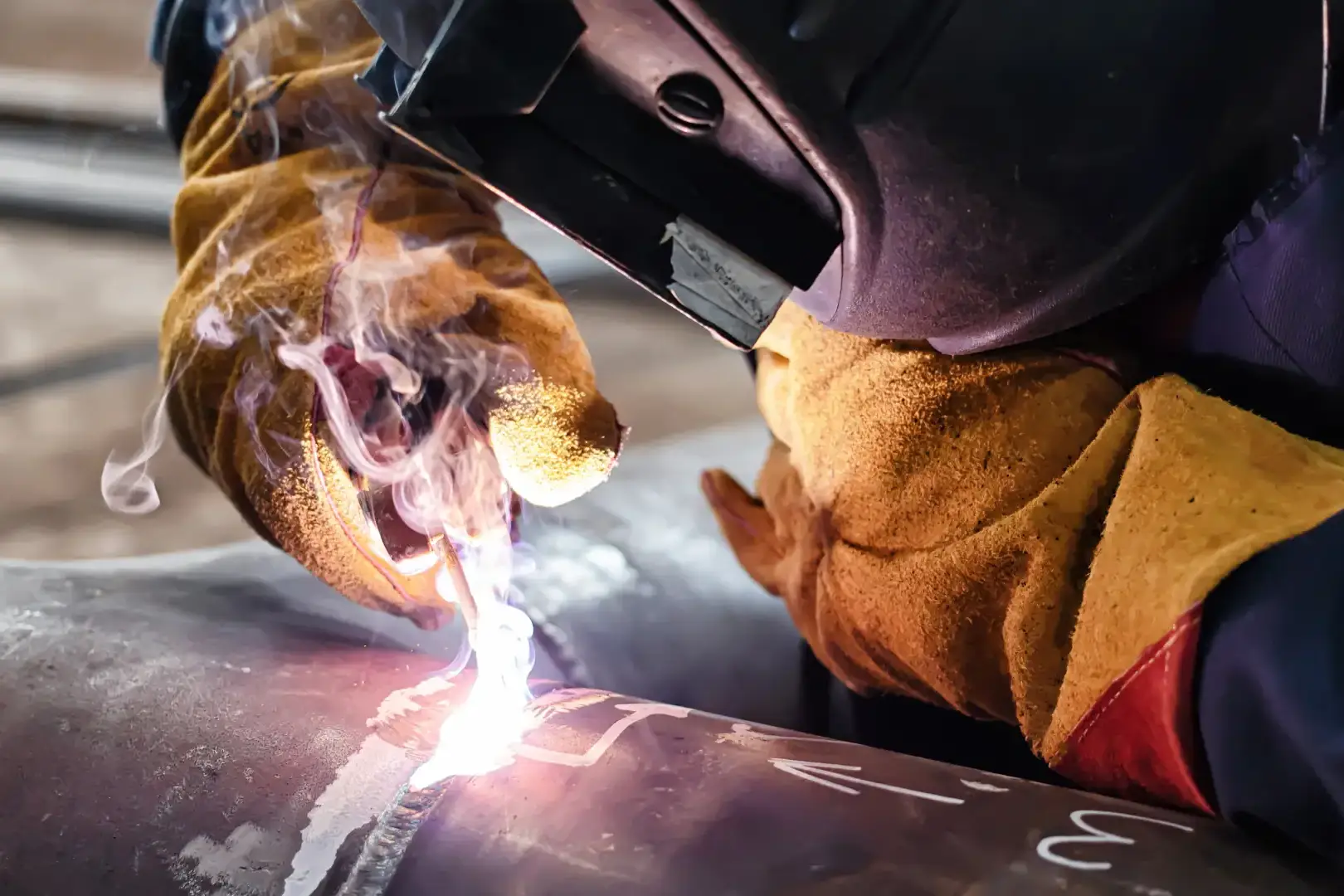 Tig welding on metal pipe.