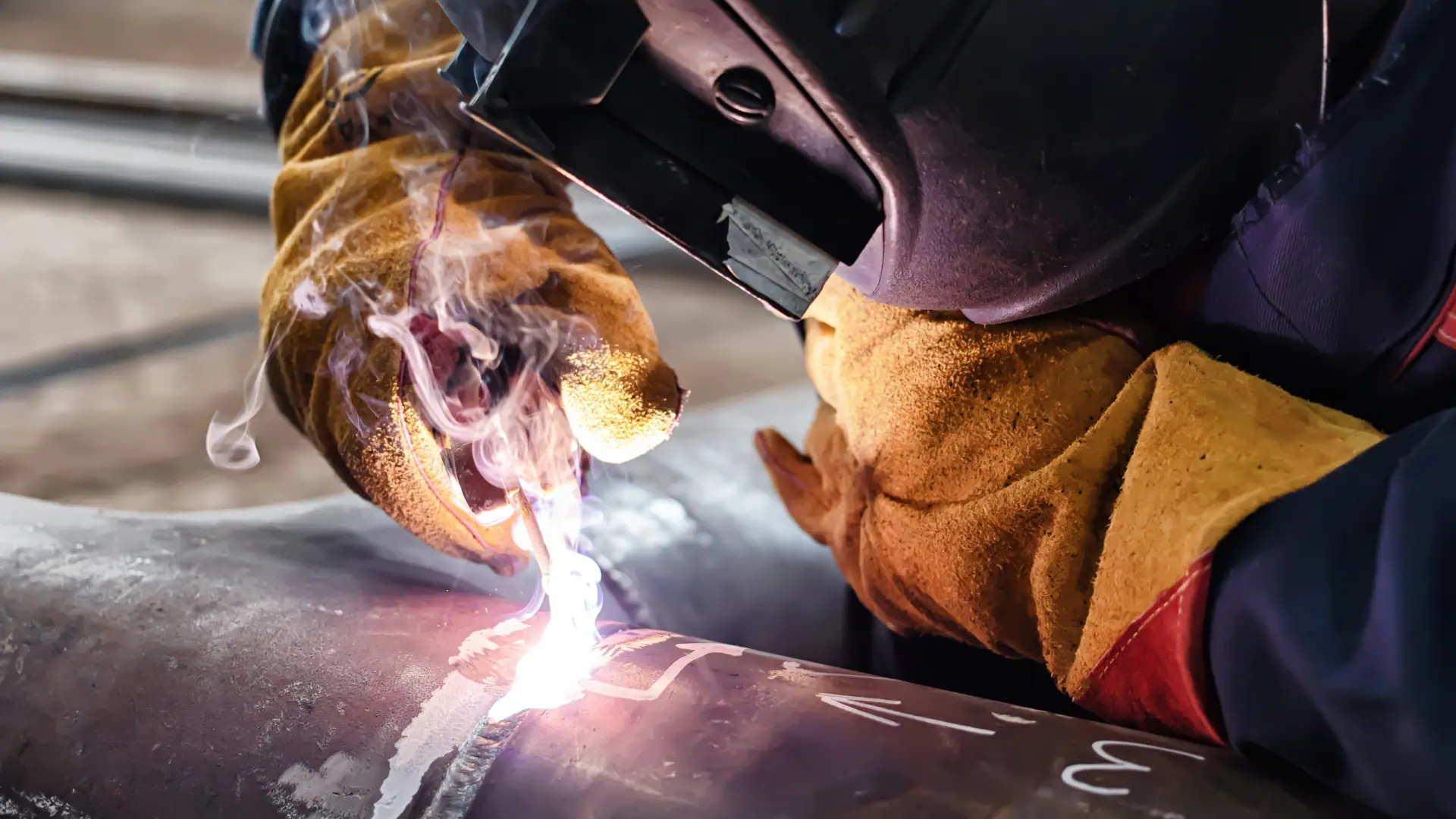 Tig welding on metal pipe.