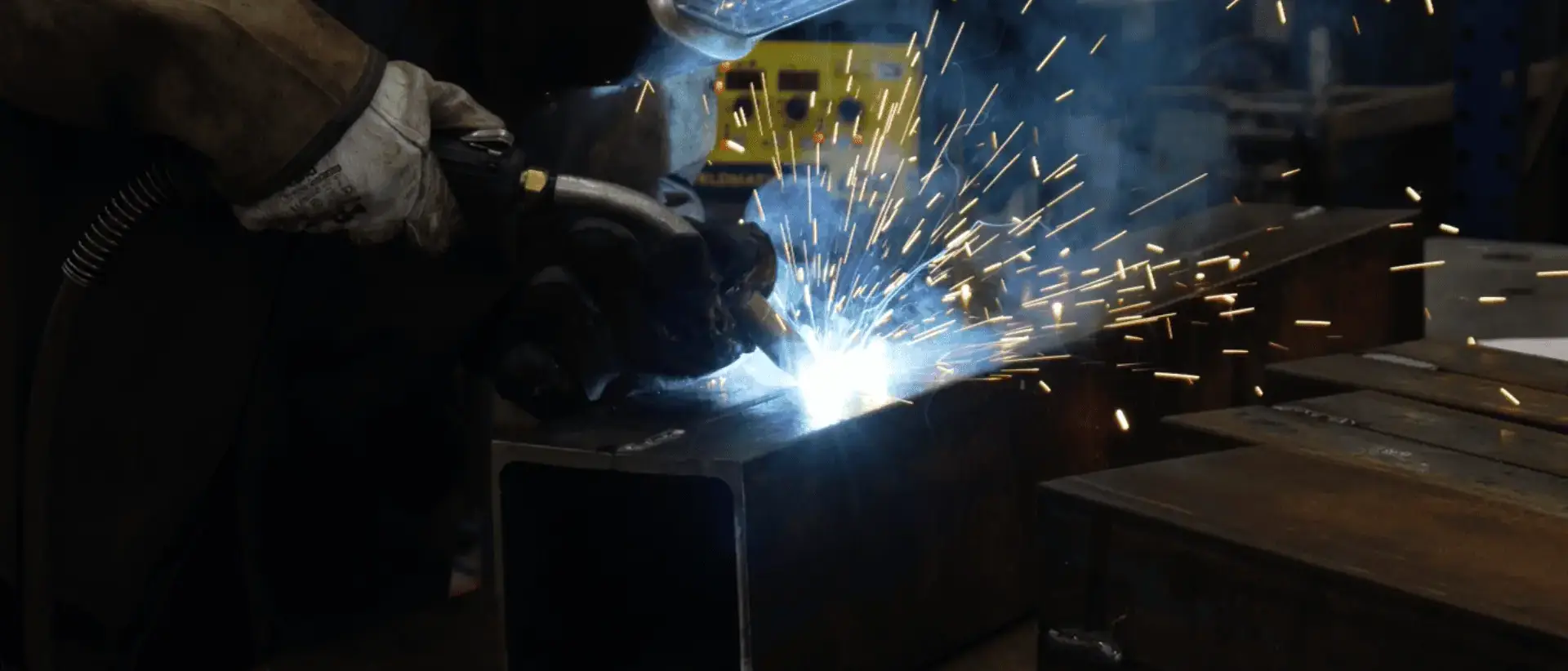 welder using a tig weld fabricating large metal beam